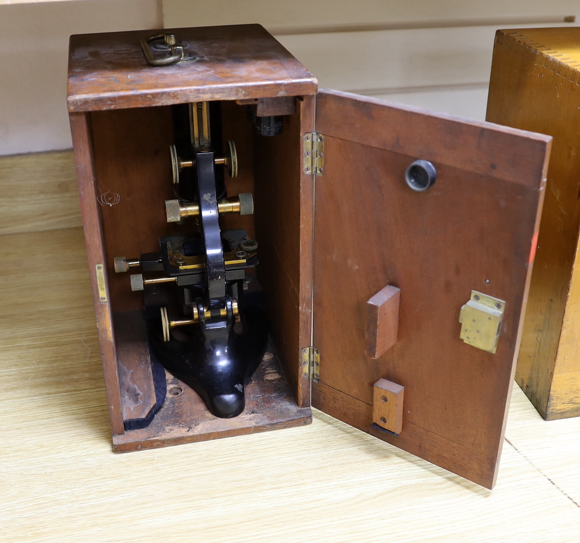 An R and J Beck Ltd monocular brass microscope, in wooden case, marked for the London School of Hygiene and Tropical Medicine (Z.235), case 36.5cm high